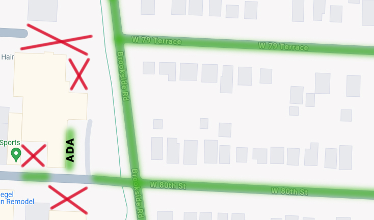 A map showing where KCZC participants can/cannot park. Brookside Road, w 79 Terrace and w 80th street, along with the parking in front of Goofball Sk8boards are marked with a green line because you can park there. The parking in Goofball Sk8boards lot is marked green, and also labelled as ADA parking. The lots in front of Crossfit, west of Goofball, and behind Goofball are marked with red Xs because you cannot park there.